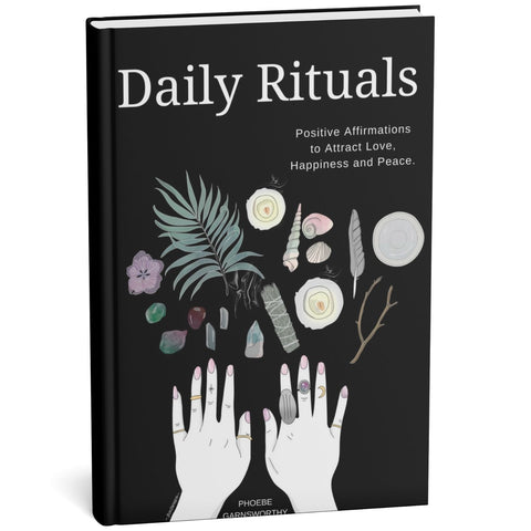 Self-help Book titled 'Daily Rituals' with illustrations of hands and nature on a black background