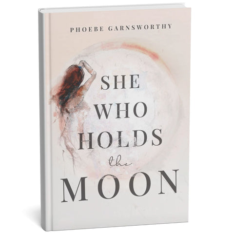 Book titled 'She Who Holds the Moon' by Phoebe Garnsworthy on a white background